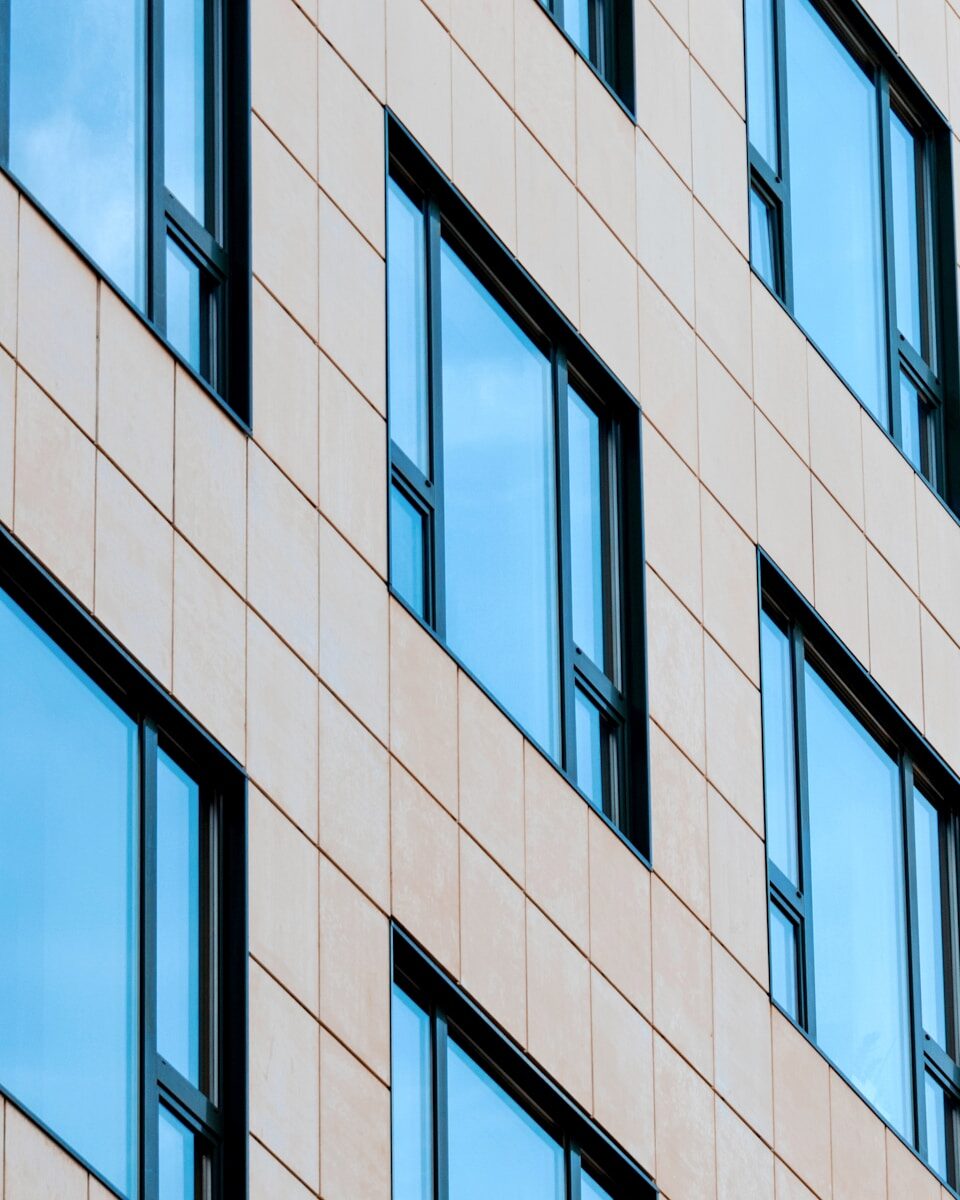 a black and white photo of a building with many windows