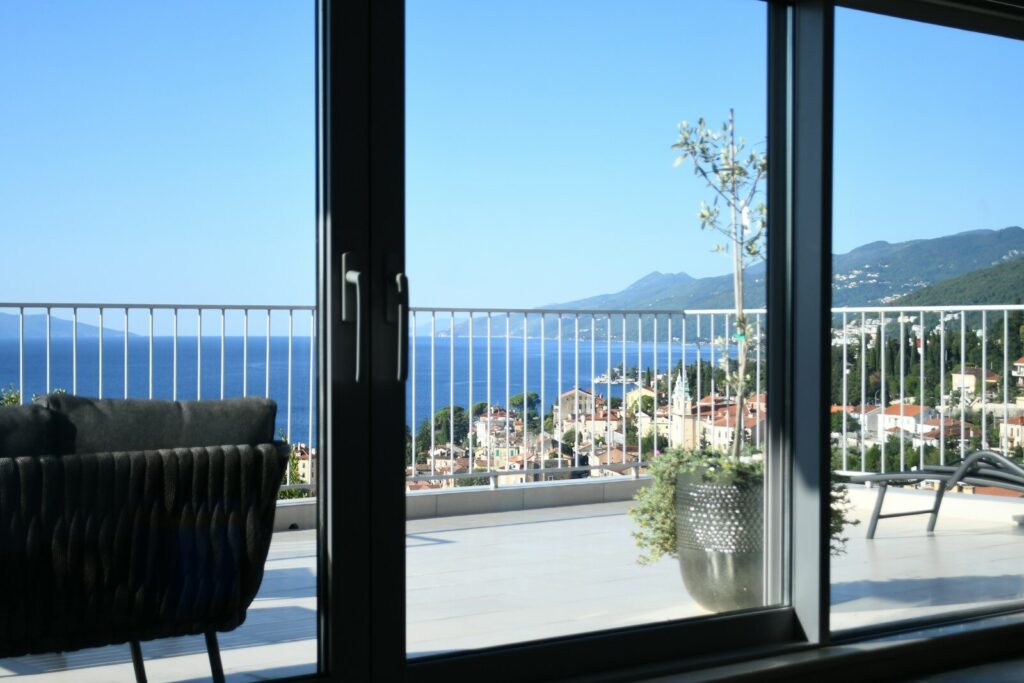 Balcony overlooking the sea and coastal town