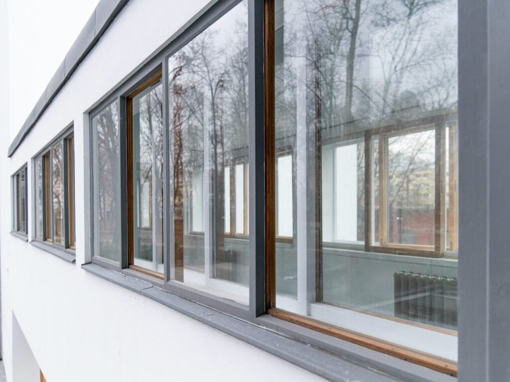 Exterior view of a building with large windows.